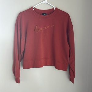 Nike cropped orange crewneck in a size small! Swoosh is carpet/rug material.